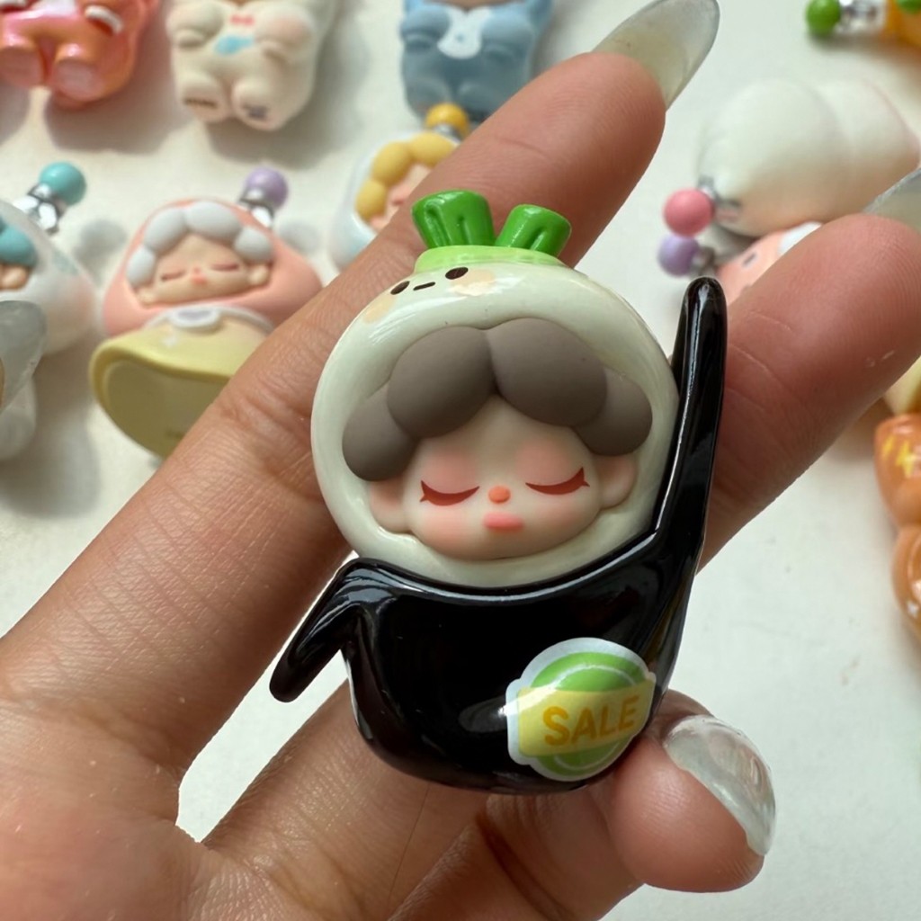 figure shown to scale, about 5 cm tall