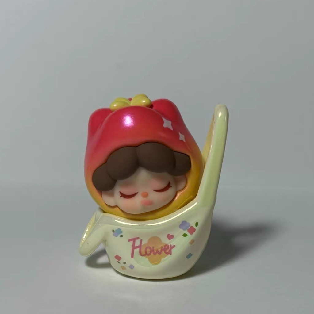 figure shown to scale, about 5 cm tall